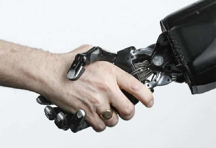 a human hand and the shadow robot dexterous hand clasping in a handshake